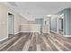 Spacious upstairs hallway features hard wood floors, neutral colored walls and lots of natural light at 1470 Lake Side Ave, Davenport, FL 33837