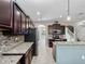 Spacious kitchen featuring sleek appliances, granite counters, and ample cabinet space at 1470 Lake Side Ave, Davenport, FL 33837