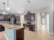 Well-designed kitchen with stainless appliances, granite countertops, and a center island at 1470 Lake Side Ave, Davenport, FL 33837