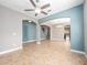 Open living area shows staircase and tile floors, neutral paint, and arched doorways at 1470 Lake Side Ave, Davenport, FL 33837