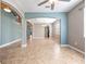 Open living area shows kitchen and tile floors, neutral paint, and arched doorways at 1470 Lake Side Ave, Davenport, FL 33837