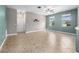 Spacious living room with tile floors, neutral paint and lots of natural light from two large windows at 1470 Lake Side Ave, Davenport, FL 33837