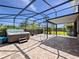 Large screened-in patio with a hot tub and ample outdoor space at 1470 Lake Side Ave, Davenport, FL 33837