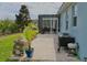 This backyard features a patio, grill and screened in porch perfect for entertaining at 1508 Bunker Drive Bunker, Davenport, FL 33896