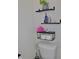 This bathroom features floating wood shelves for stylishly storing all your toiletries at 1508 Bunker Drive Bunker, Davenport, FL 33896