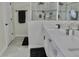 Modern bathroom with double vanity, quartz countertops, sleek fixtures, and a glass-enclosed shower at 1508 Bunker Drive Bunker, Davenport, FL 33896
