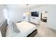 Bedroom with a TV, neutral decor, and a view into the walk-in closet at 1508 Bunker Drive Bunker, Davenport, FL 33896