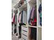 Walk-in closet with custom shelving and ample storage space for clothing and accessories at 1508 Bunker Drive Bunker, Davenport, FL 33896