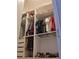 Well-organized closet with built-in shelves and hanging rods for efficient storage of clothing and shoes at 1508 Bunker Drive Bunker, Davenport, FL 33896