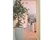 Hallway featuring decorative plants, light wood-look tile flooring, and an open concept view to the living spaces at 1508 Bunker Drive Bunker, Davenport, FL 33896