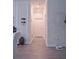 Hallway with tile floors, neutral walls, and modern decor leading to other rooms in the home at 1508 Bunker Drive Bunker, Davenport, FL 33896