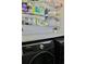 This laundry room features a stainless steel washer and dryer and shelving for storage at 1508 Bunker Drive Bunker, Davenport, FL 33896