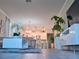 Stylish living room showcasing an open layout with a modern kitchen, bar seating, and elegant decor at 1508 Bunker Drive Bunker, Davenport, FL 33896