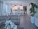 Spacious living room with open floor plan offering a view of the kitchen, dining area and a comfortable seating area at 1508 Bunker Drive Bunker, Davenport, FL 33896