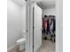 Walk-in closet featuring ample storage space with organized shelving and clothing at 1524 Fleur Dr, Davenport, FL 33837