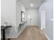 Bright foyer featuring wood floors, neutral walls and an arched doorway at 1524 Fleur Dr, Davenport, FL 33837