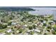 Aerial view of a lakeside community, showing the neighborhood layout and nearby lake at 1626 Gar St, St Cloud, FL 34771