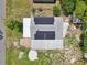Aerial shot showing the home's roof with solar panels and extended metal awning at 1626 Gar St, St Cloud, FL 34771