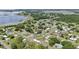 Beautiful aerial view of a lakeside community with tree-lined streets and well-maintained homes at 1626 Gar St, St Cloud, FL 34771