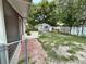 Backyard with storage shed and mature trees, ready for landscaping and outdoor enjoyment at 1626 Gar St, St Cloud, FL 34771