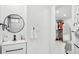 Modern bathroom featuring sleek fixtures, a vanity, and a well-organized closet, offering convenience and style at 1626 Gar St, St Cloud, FL 34771