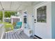 Inviting front porch features a chair and stylish decor near the front door at 1626 Gar St, St Cloud, FL 34771