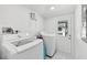 Bright laundry room with modern washer and dryer, offering convenience and efficiency for household chores at 1626 Gar St, St Cloud, FL 34771
