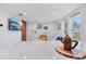 Cozy living room showcasing white walls, modern decor, and abundant natural light streaming through windows at 1626 Gar St, St Cloud, FL 34771