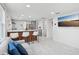 Open living space showcasing a stylish kitchen island with seating and modern decor at 1626 Gar St, St Cloud, FL 34771