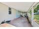 Enclosed patio offers ample space, an exterior window, and backyard access at 1626 Gar St, St Cloud, FL 34771