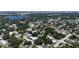 High aerial view over the residential area shows mature trees, quiet streets, and cityscape view at 1712 Melvin Ave, Orlando, FL 32806