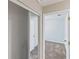This bedroom features neutral walls and carpet, complemented by white trim and doors at 1712 Melvin Ave, Orlando, FL 32806