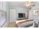 Tranquil bedroom with TV, ceiling fan, and closet, designed for comfortable living and relaxation at 1712 Melvin Ave, Orlando, FL 32806