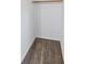 Empty carpeted walk-in closet with built-in hanging rod at 1712 Melvin Ave, Orlando, FL 32806