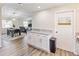This modern kitchen offers granite countertops, stainless steel appliances, and an open view to dining area at 1712 Melvin Ave, Orlando, FL 32806