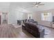 A bright living room with a stylish table set, comfortable sofa, and lots of natural light at 1712 Melvin Ave, Orlando, FL 32806