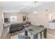Comfortable living room featuring neutral walls, wood floors, and a modern ceiling light fixture at 1712 Melvin Ave, Orlando, FL 32806