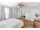 Bright main bedroom featuring neutral tones, mirrored closet, and large window at 1712 Melvin Ave, Orlando, FL 32806