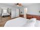 Spacious main bedroom featuring neutral tones, a mirrored closet, and a private ensuite bathroom at 1712 Melvin Ave, Orlando, FL 32806
