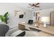 Bright office features a ceiling fan and a large desk area, perfect for working from home at 1712 Melvin Ave, Orlando, FL 32806
