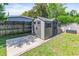 This shed offers additional storage space with its clean design and matching trim at 1712 Melvin Ave, Orlando, FL 32806
