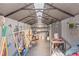 Interior of storage shed featuring storage shelves and multiple lawncare tools at 1712 Melvin Ave, Orlando, FL 32806