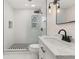 Modern bathroom showcasing sleek fixtures, patterned tile and glass enclosed shower at 1842 Puritan Ave, Winter Park, FL 32792