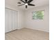Bedroom featuring hardwood floors, ceiling fan, a window and closet at 1842 Puritan Ave, Winter Park, FL 32792