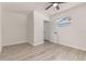 Bright bedroom featuring a ceiling fan, neutral walls, and light colored wood-look flooring at 1842 Puritan Ave, Winter Park, FL 32792