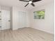 Bedroom featuring hardwood floors, ceiling fan, a window and closet at 1842 Puritan Ave, Winter Park, FL 32792