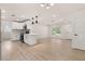 Spacious open concept kitchen featuring modern appliances and white cabinets at 1842 Puritan Ave, Winter Park, FL 32792