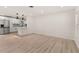 Open floor plan showcasing the kitchen, living area, and stainless steel appliances at 1842 Puritan Ave, Winter Park, FL 32792