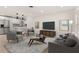 Open-concept living room with a modern design and updated kitchen appliances at 1842 Puritan Ave, Winter Park, FL 32792