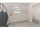 Room featuring wood floors, open door and installed shelving at 1842 Puritan Ave, Winter Park, FL 32792